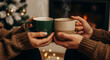 © ASAD - Couple enjoying hot coffee together by the fireplace at Christmas