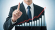 © Md - Business Growth on Hand Pointing Finger Upward Trend with Red Arrow and Bar Chart Strategy Goal Success Investment Development and Achievement