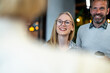 © Migma_Agency - Happy business colleagues smiling and collaborating in office meeting