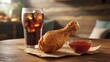 © Josna - Crispy fried chicken drumstick with a refreshing soda and red sauce in restaurant setting