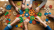 © Ace - Top down flat lay overhead view of multiple diverse hands collaborating to connect colorful wooden gears and cogs into a complex mechanical system on a desk