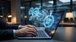 © Desmon - Executive hands on laptop with glowing 3D automated workflow gears