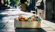 © NURULDDDD - A Box of Assorted Stuffed Animals on a Cobblestone Street.