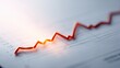 © Generative AI - Close up of a rising red line graph on paper showing financial growth and positive trend