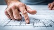 © Generative AI - Close-up of architect's finger pointing at blueprint plans for building construction project