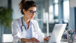 © suldev - Female Doctor Managing Medical Coding And Billing