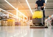 © Jahanara - Person cleaning floor with yellow machine grey