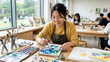 © studioROSSY - Smiling Student Mixing Paint Colors at a Neat Desk in Bright Classroom