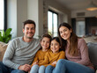© FOYSALHOQUE - Happy family sitting together in a modern living room