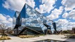 © horizon - The reflective glass facades of a state-of-the-art university science building beautifully mirror the bright blue sky and fluffy clouds.