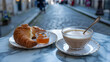 © MDShah - Traditional french breakfast with buttery croissant jam and cafe au lait on marble table in paris