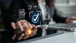 © InfiniteFlow - Business professional interacting with digital check mark interface while managing documents and data on modern touchscreen device in modern office environment Sigmoid