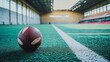 © Dot - American football resting on vibrant green turf within a spacious indoor stadium setting.