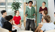 © JackF - Teen group sit in circle and listen to African American boy classmate speaking, teacher watching. Acting masters courses, stage speech courses, public speaking courses