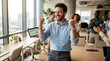 © Dara - A man is celebrating a business achievement with his colleagues in a modern office. He is raising a tablet displaying a graph showing upward growth, while his colleagues cheer and applaud.