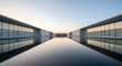© Roktim - Modern minimalist architecture building with glass facade reflecting in a calm water pool at sunset