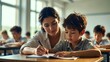 © Olga - Female Teacher Helping Young Boy with Writing Task in Class