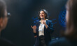 © Konstantin Yuganov - Confident Businesswoman Speaking at Technology Conference, Inspiring Audience