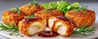 © Georgii - Crispy breaded chicken nuggets cut in half with melted cheese and rich dipping sauce on plate