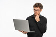 © InsideCreativeHouse - Laptop, thinking and business man in studio for ideas, problem solving and solution on white background. Corporate, professional and person on digital tech for networking, website review and research