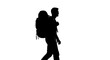 © Asrul - Silhouette of a hiker with a backpack walking against a white background