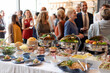© Rawpixel.com - Buffet gathering with diverse crowd