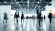 © CStock - A busy exhibition hall filled with blurred people walking, showcasing the dynamism of modern business events.