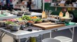 © Zahra - Food truck prep station with fresh ingredients and cooking utensils ready for service