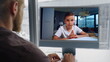© stockbusters - Teacher talking online computer lesson with kid home closeup. Remote education