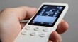 © Nataly - Modern AC remote control held in hand, featuring touch screen and multiple buttons for temperature adjustment. AC remote control is essential for comfortable living environments.