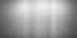 © MasterCrafted - Polished silver brushed metal texture background with a shiny industrial stainless steel plate surface and grey aluminum sheet material design