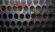 © paijok - Rusted metal sheet with circular holes creating a pattern on a dark background, showing texture and wear