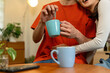 © MIND AND I - Young Asian Couple Sharing a Loving Moment with Coffee at Home