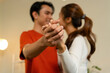 © MIND AND I - Close-Up of Loving Couple Holding Hands and Dancing at Home