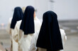 © Godong Photo - Dominican convent of Monteils. Group of Dominican sisters wearing traditional white robes and black veils. Catholic mass.  Monteils.  France.