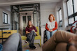 © Halfpoint - Teen students talking together in inclusive school setting.