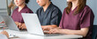 © buritora - Medical, conference/study group/seminar/training, male and female medical staff in scrubs attending training.