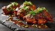 © Plaifah - Spicy chicken wings garnished with fresh herbs on a textured slate plate, ideal for food photography, culinary presentation, and dining settings exploration