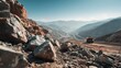 © HikmahCreative - Massive Mining Truck Navigates a Vast Open Pit Mine Under a Clear Blue Sky Amidst Rugged Mountainous Terrain With Rocky Foreground and Sunlit Slopes