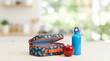 © Mobasser - Back to school, colorful lunchbox with apple and water bottle on kitchen counter, copy space for advertisement or educational material