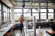 © BusinessClass by W61 - Mature engineer walking at workshop