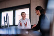 © BusinessClass by W61 - Female doctor discussing with patient sitting at computer desk in hospital