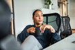 © Marko Geber - Thoughtful woman enjoying coffee at office desk