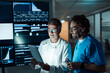 © BusinessClass by W61 - Medical professionals analyze data on tablet in hospital