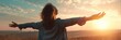 © Lady O - A woman with her arms outstretched, enjoying the fresh air and sunshine on a summer day, in a panoramic banner.