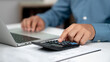© Wachirapong - Modern business accounting management: Using technology for efficient tax calculations, accounting, assets, balance sheets, stock market statistics, and annual tax laws to protect businesses.