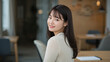© bephoto - コワーキング空間で休憩中に微笑む日本人女性のポートレート