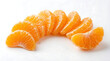 © Essence Stock Creati - Fresh tangerine slices on white surface food photography bright and clean environment close-up view for culinary inspiration