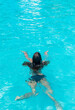 © yanadjan - kid girl swimming in pool. selective focus.