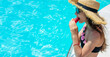© yanadjan - girl eating watermelon near the pool. selective focus.